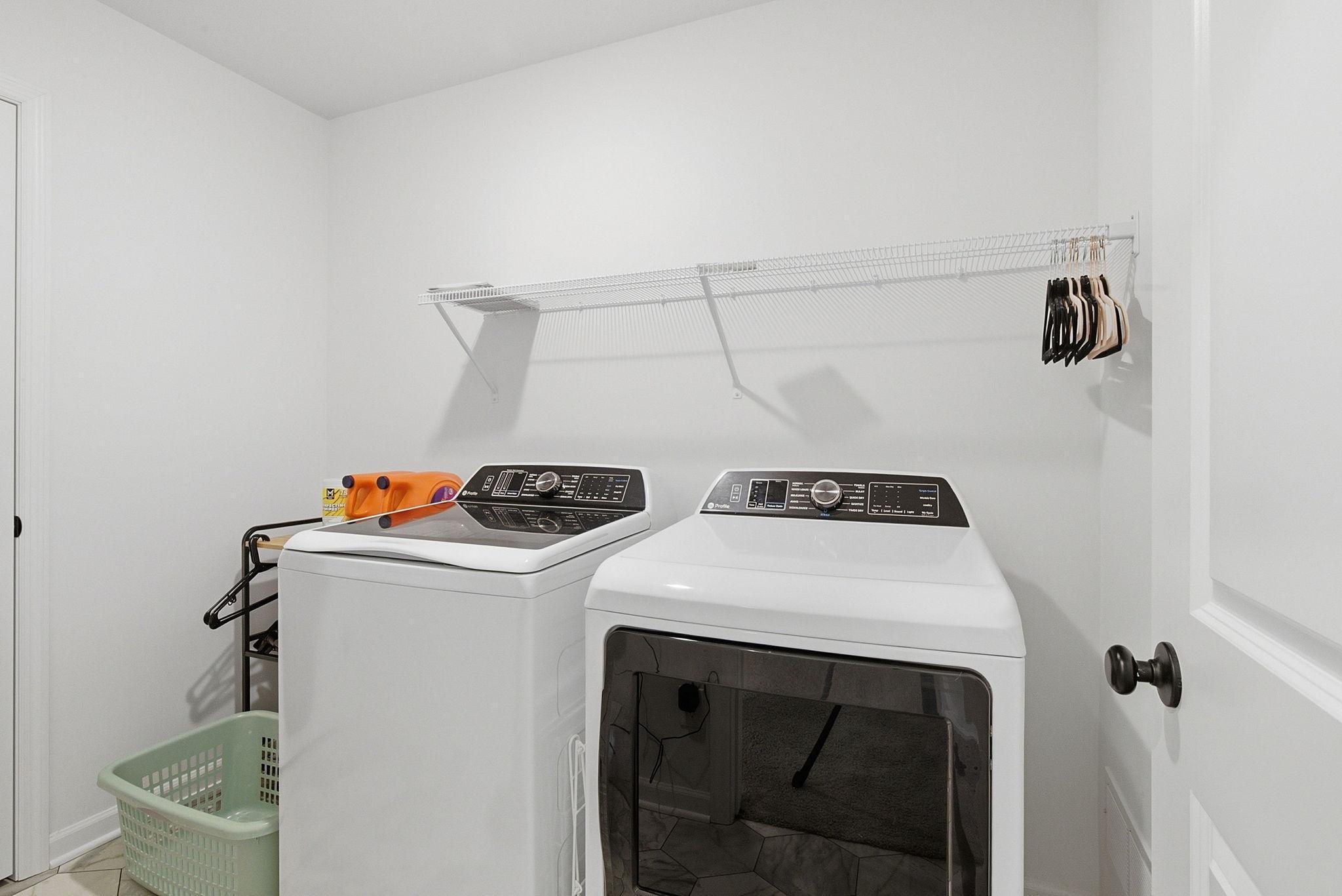 The upper-level laundry offers convenient accessibility along with extra storage space in the closet, along with the water heater and NEW soft water.