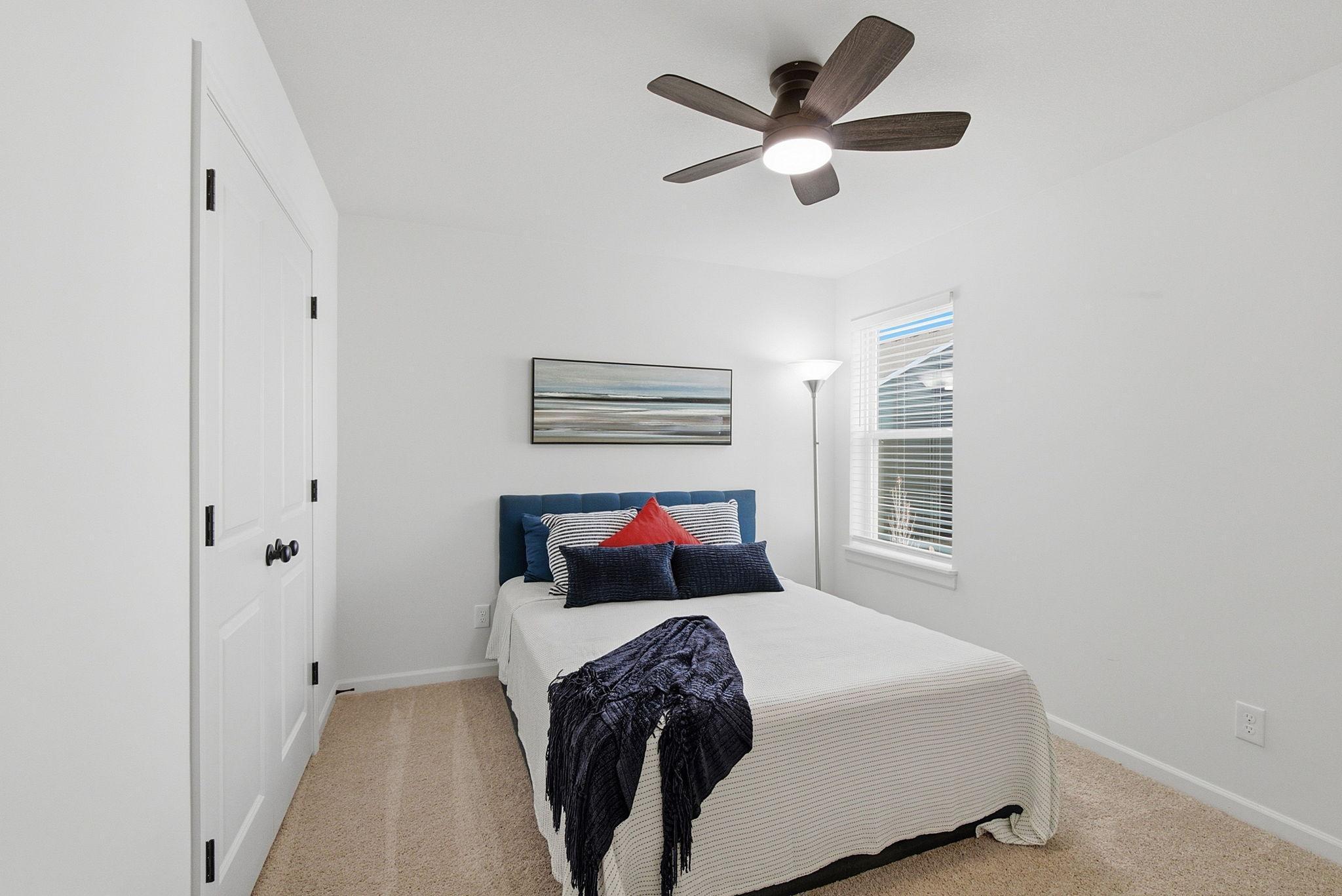 All new window treatments through out, in this extra deep bedroom