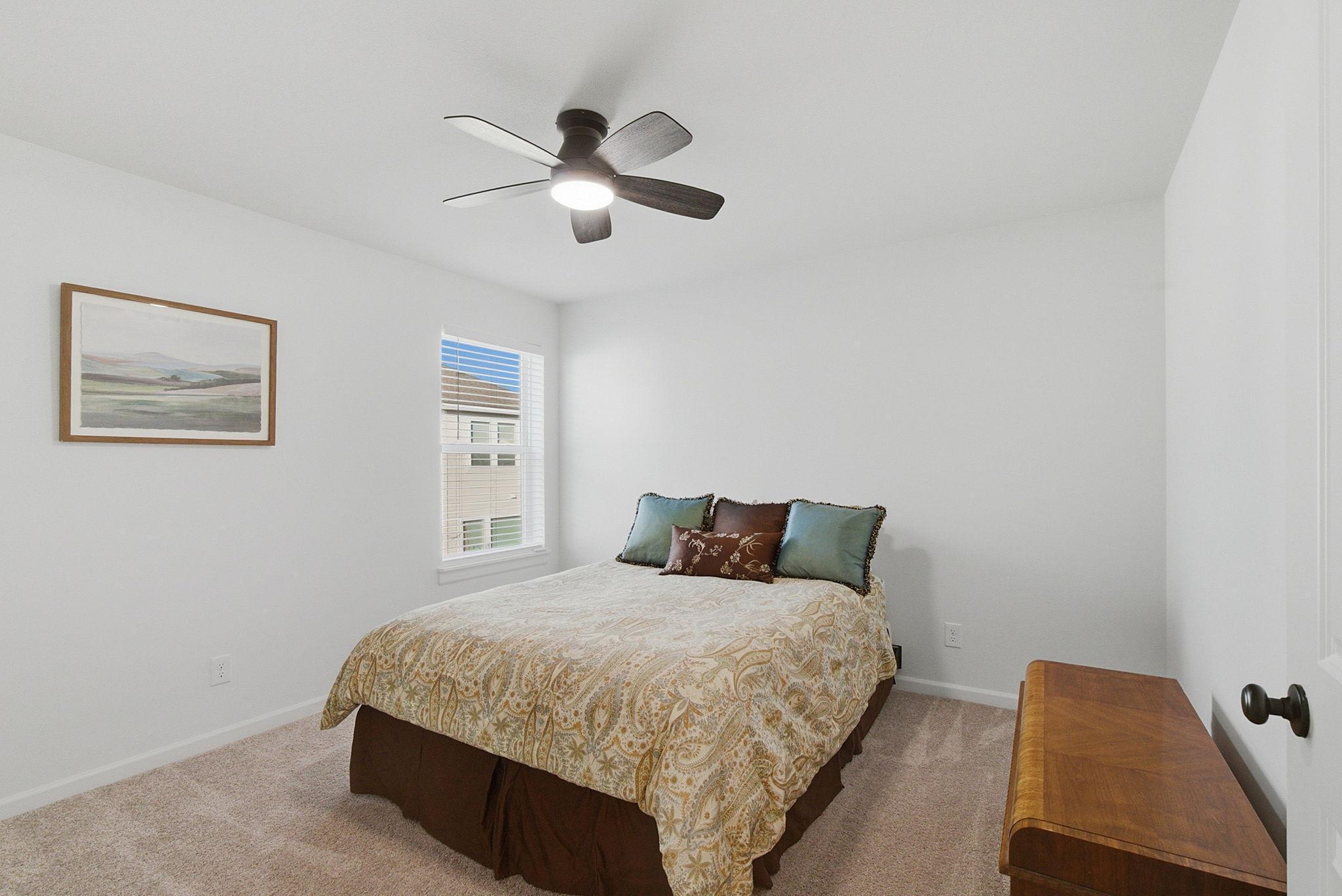 The third upper-level room is situated on the back side of the home for added privacy.