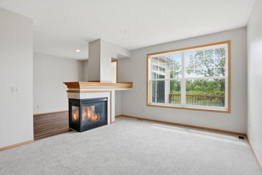 Dual sided fireplace that you can enjoy from the living room and dining room