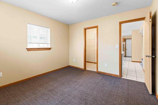 Lower unit primary bedroom with walk-in closet