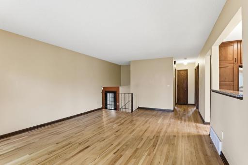 The great room connects to a central hall reaching the front entry, kitchen, and bedroom wing in just a few steps.