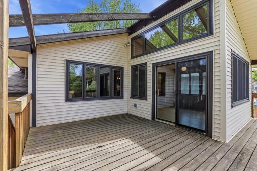 Tucked beside the sunroom and pergola, the deck pulls daily life outside for coffee, dinners, or quiet weekend afternoons.