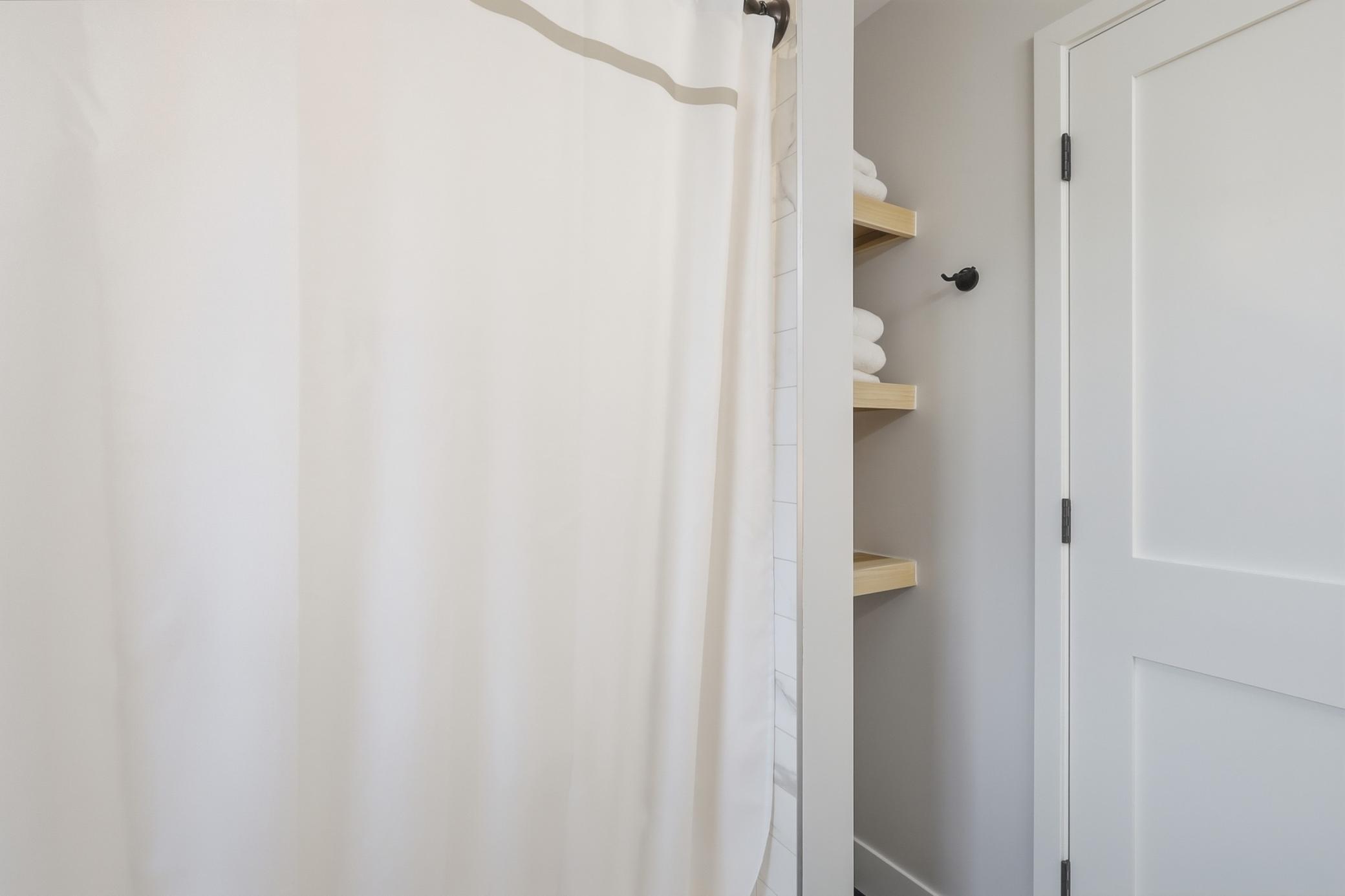 Upper level 2nd bath shower and custom shelving