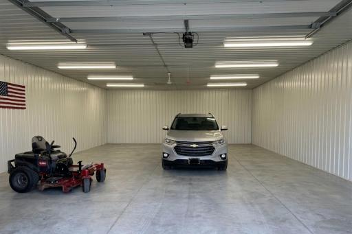 10x12' electric open garage door. Full sheet metal inner 12'H walls.