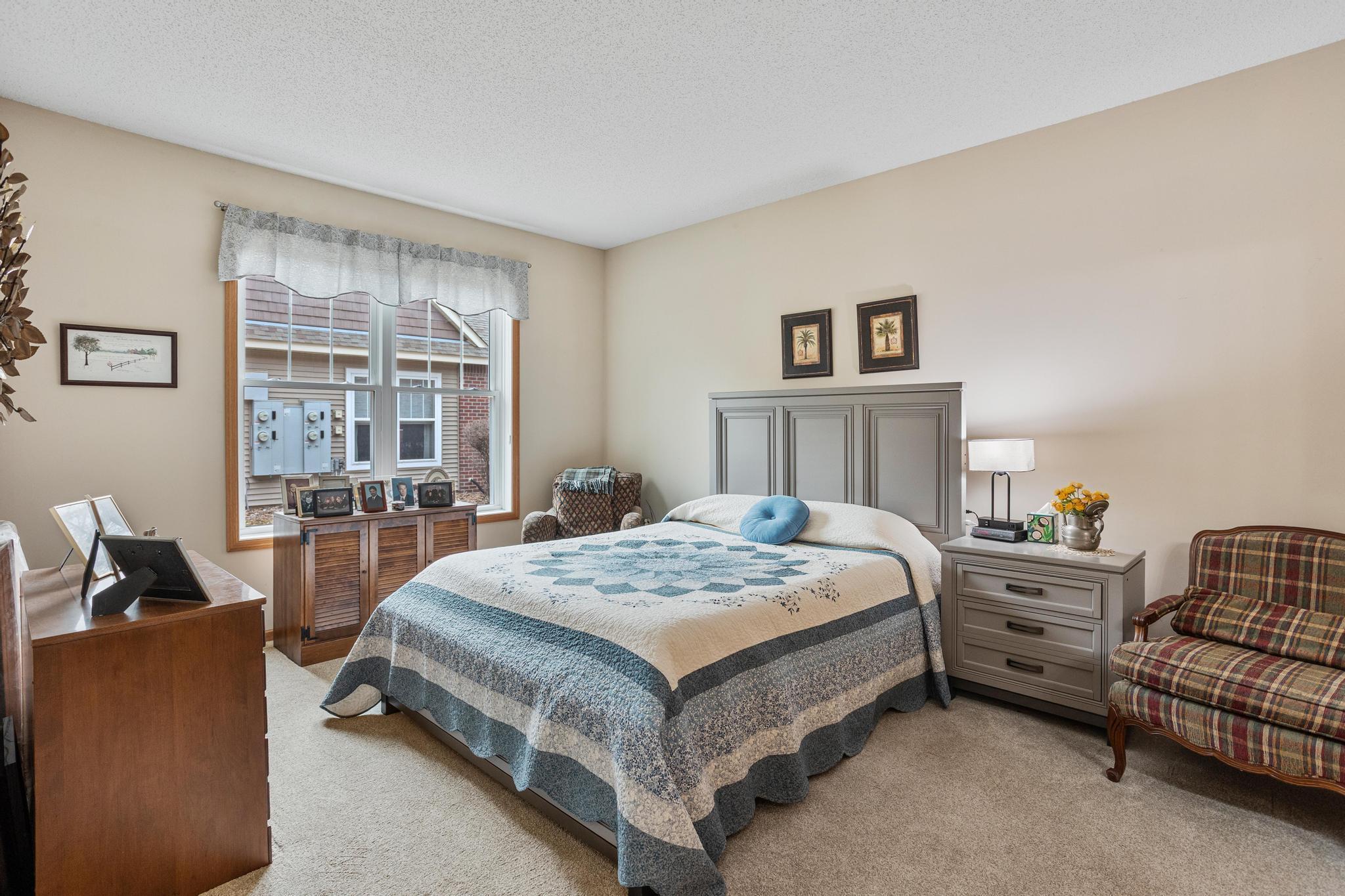 Spacious primary bedroom with its private bath and walk-in closet.