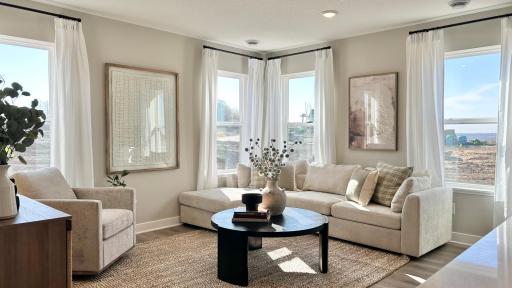 Cozy family room with ample natural light - this is the space you will want to spend time in!