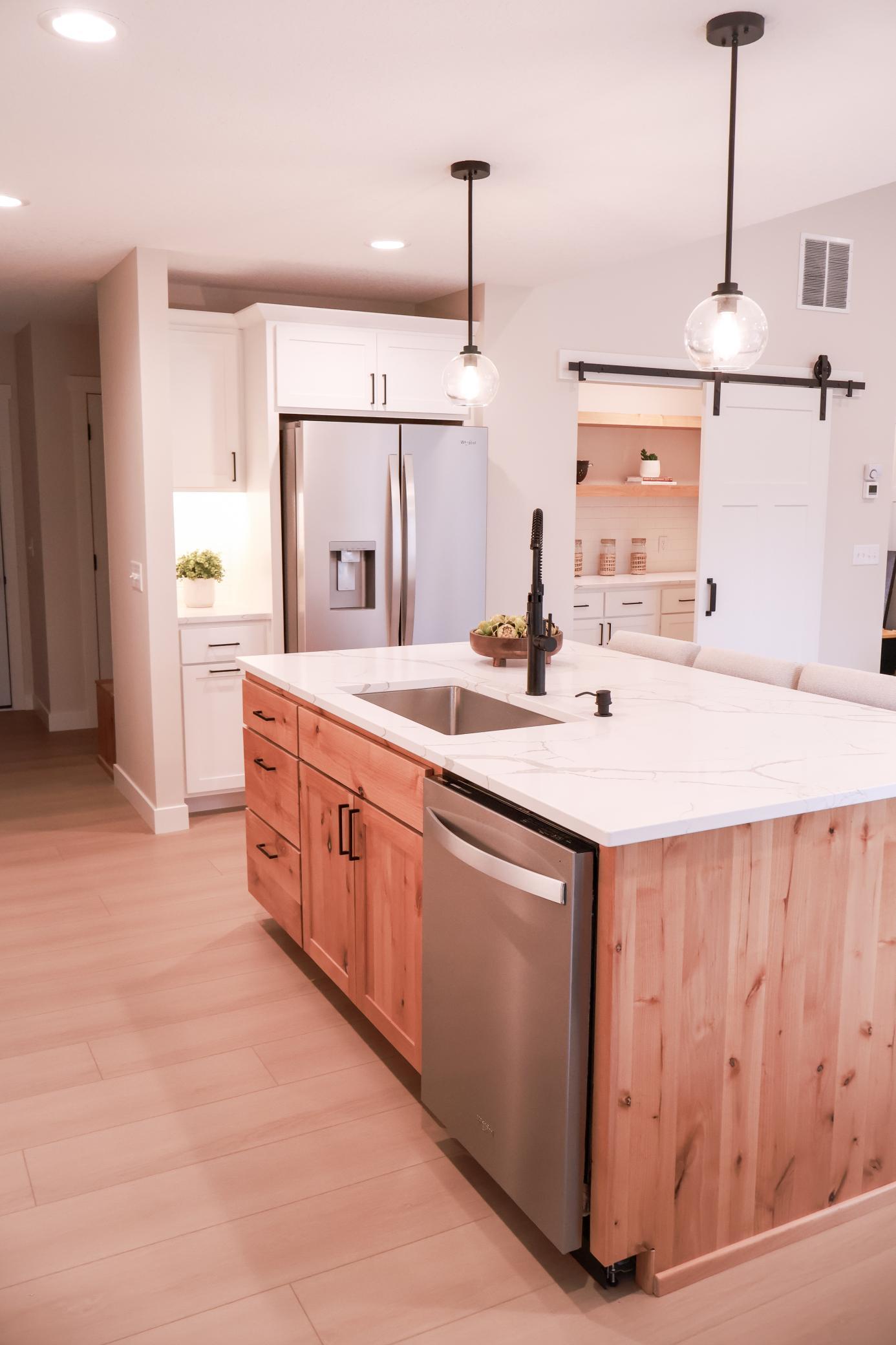 Kitchen boasts large center island walk in pantry