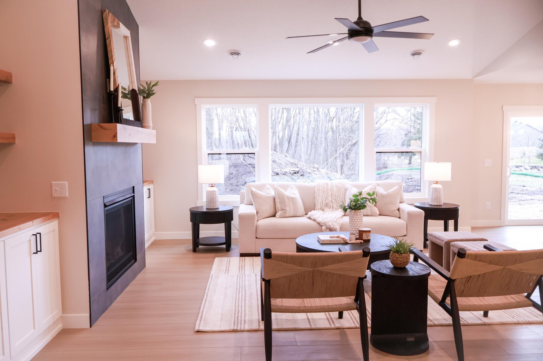 Living room features gas fireplace and beautiful views to your back yard.