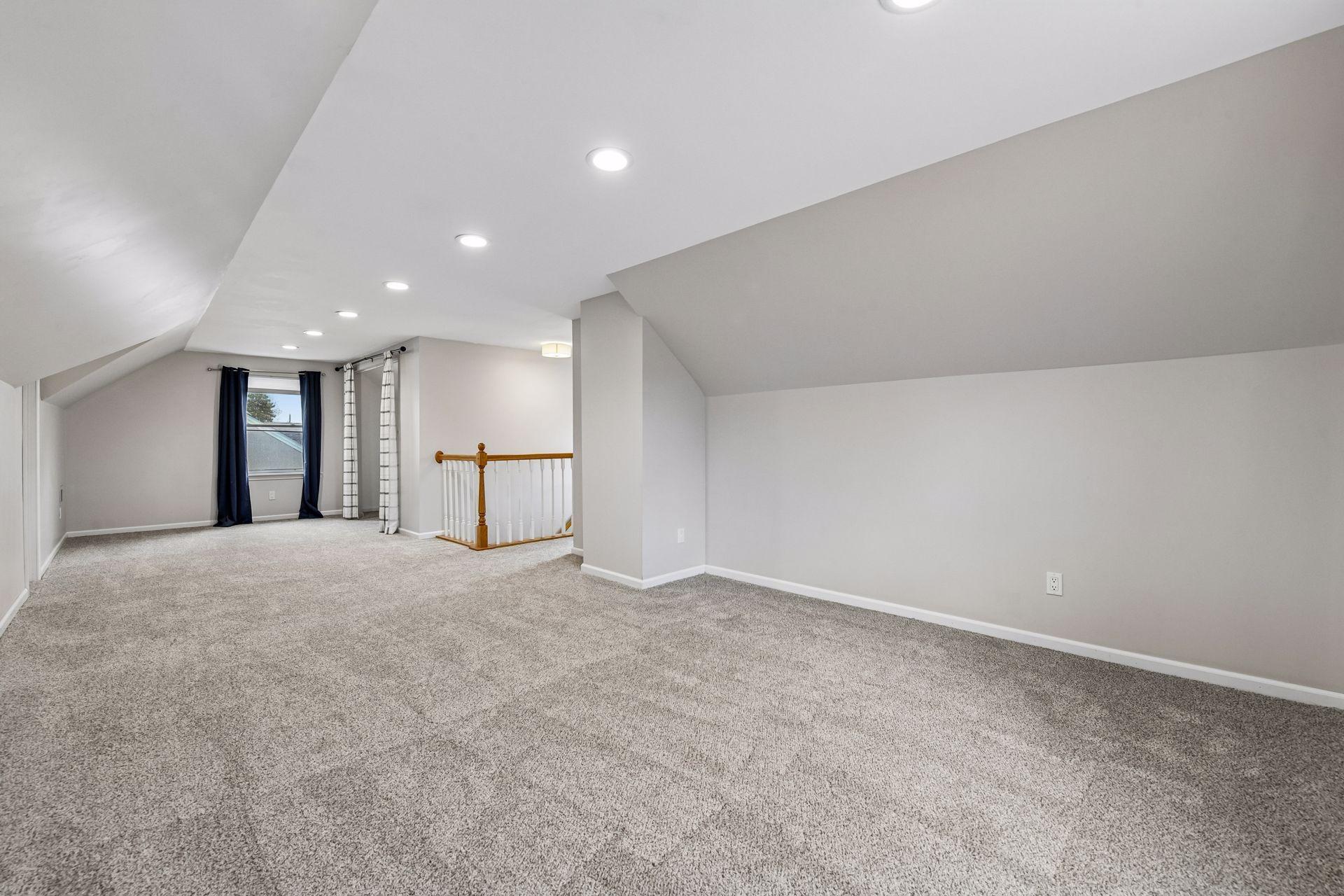 Upstairs is the primary bedroom suite with a three-quarter bathroom.