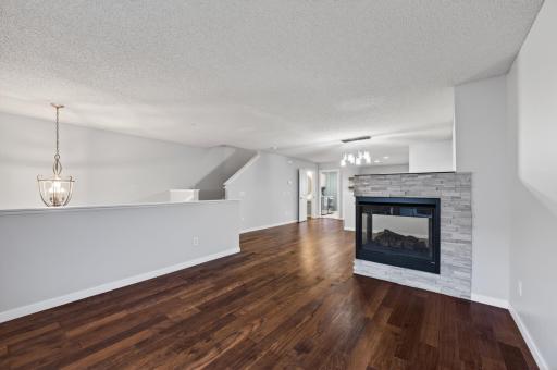 Living Room with three side gas fireplaces.