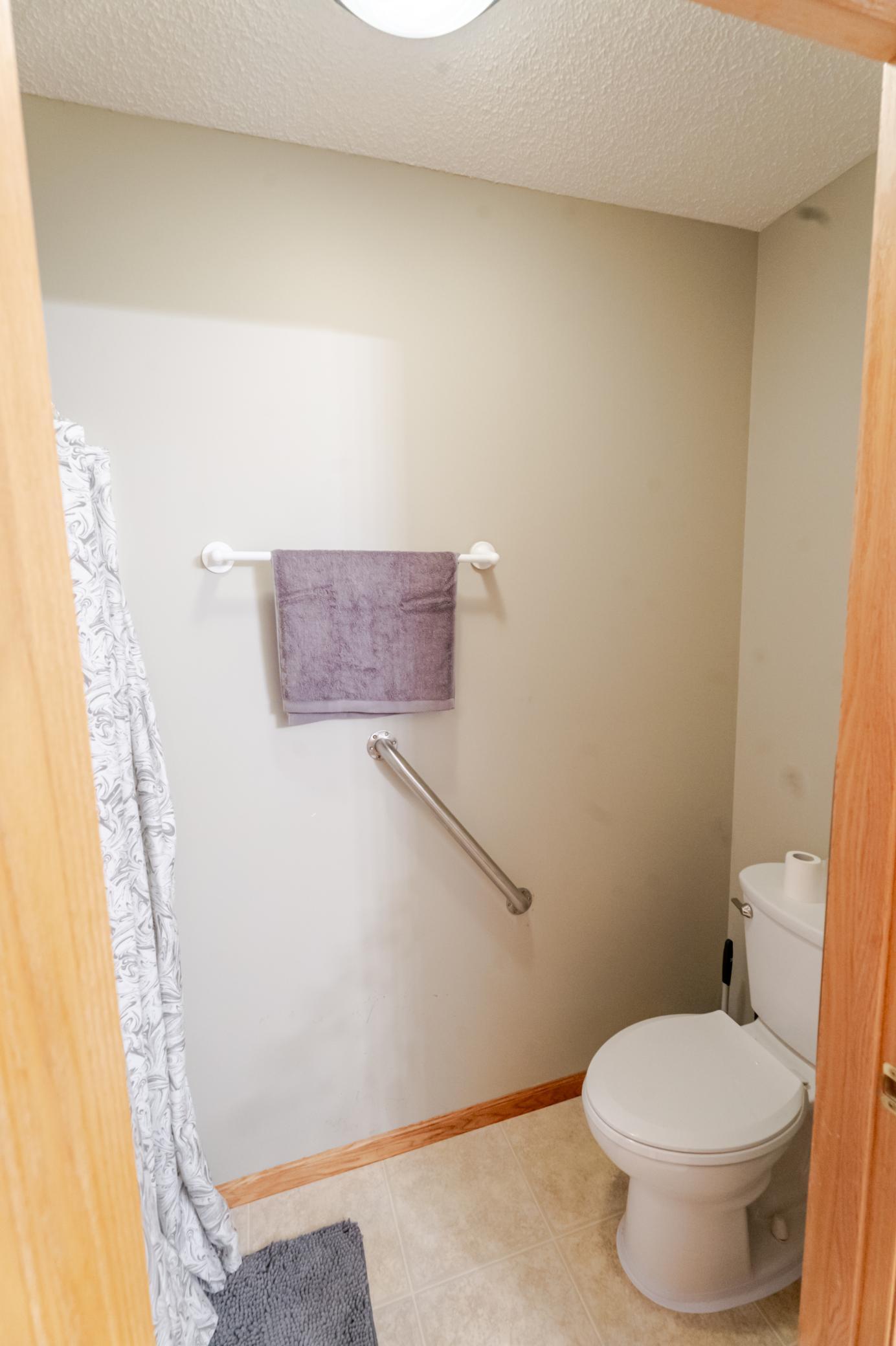 Separate room for toilet and bonus shower in upstairs bath