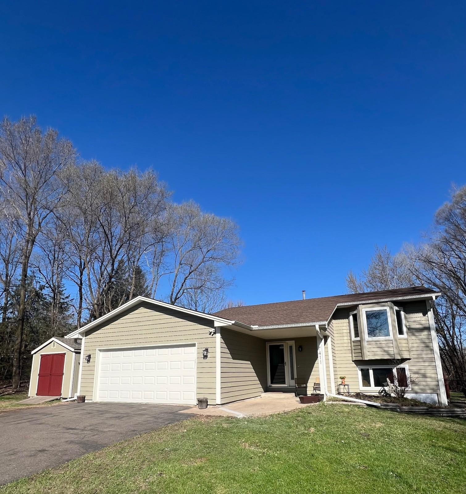 Covered front entrance, by window, nice large storage shed are just some of the nice touches found in this home.
