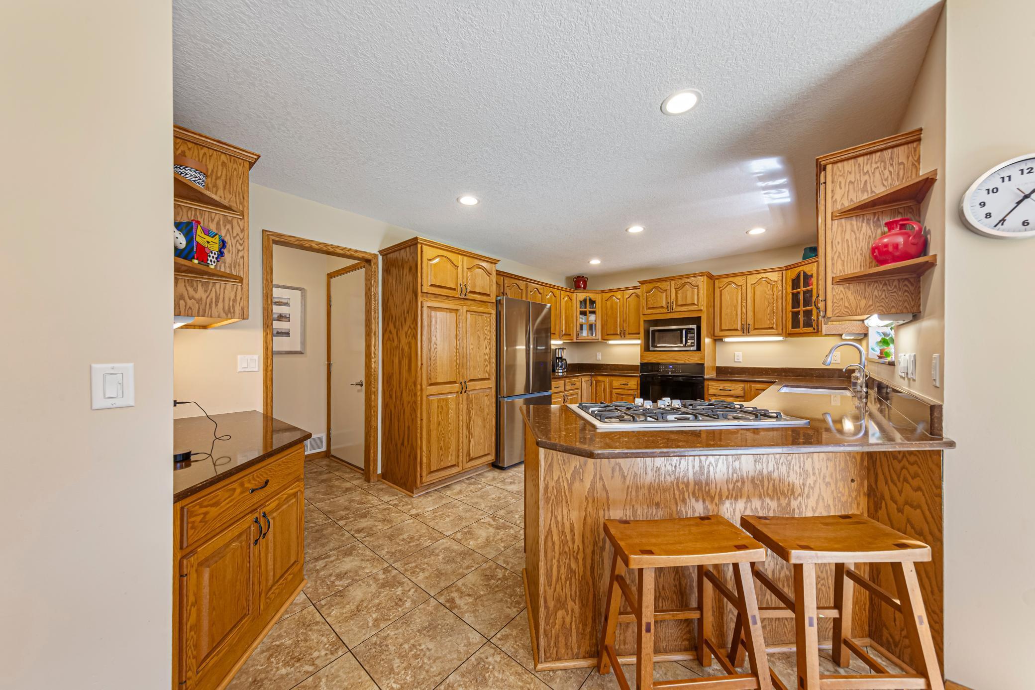 Kitchen/Breakfast Bar/Granite Countertops/Desk Area/Custom Cabinets/Stainless Appliances/Brand New Refigerator.jpg
