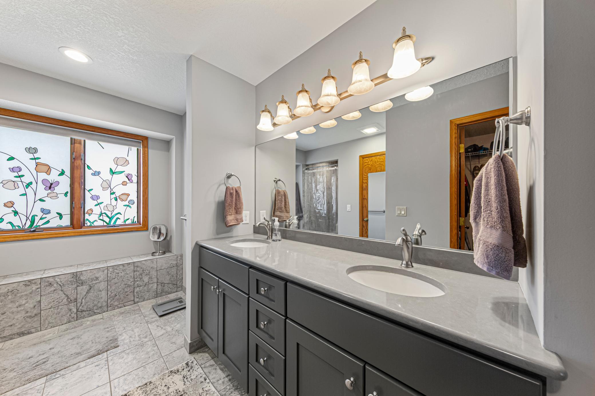 Primary Bath/Updated/Tile Floors/W?I Tile Shower/Double Vanities.jpg
