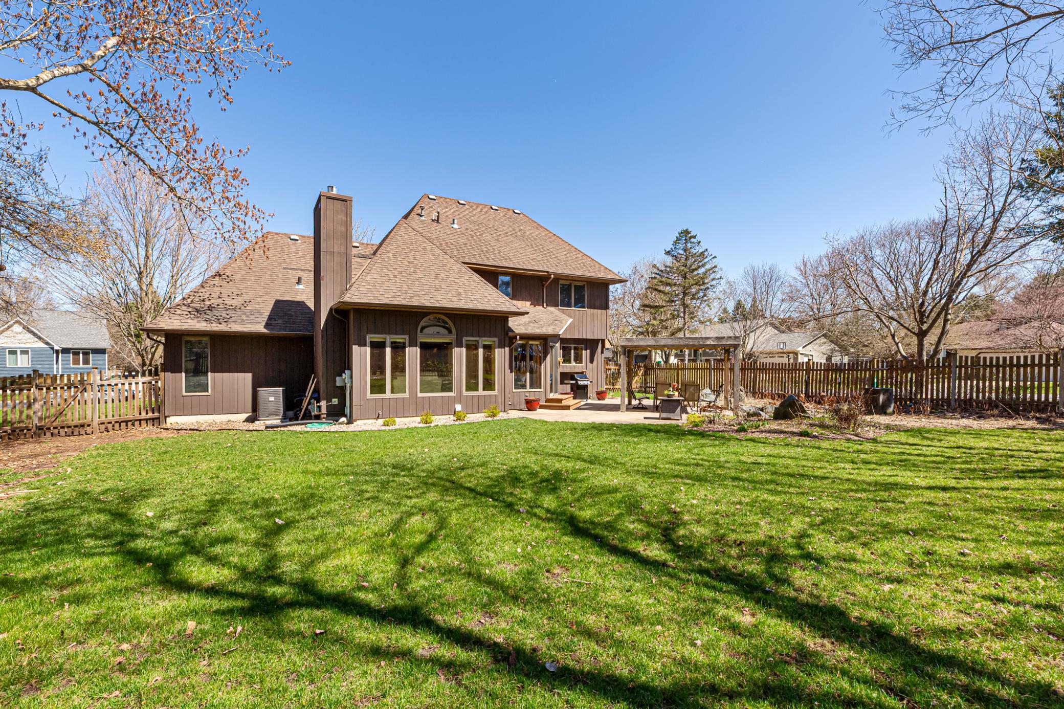 Huge Backyard with A Large Cement Patio/Pergola/Rock Stream Bed Area/Tons of Perennials/Lots Of Yard Space/Wood Fence/Tons of Nature.jpg