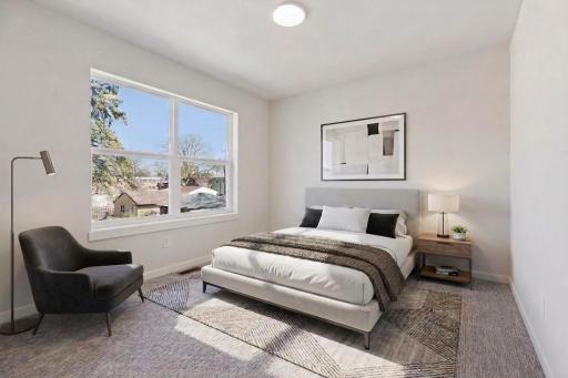 Virtually Staged! Bright fourth bedroom on the upper level with large window, soft carpeting, and neutral finishes. Comfortable and versatile space for family, guests, or office use.