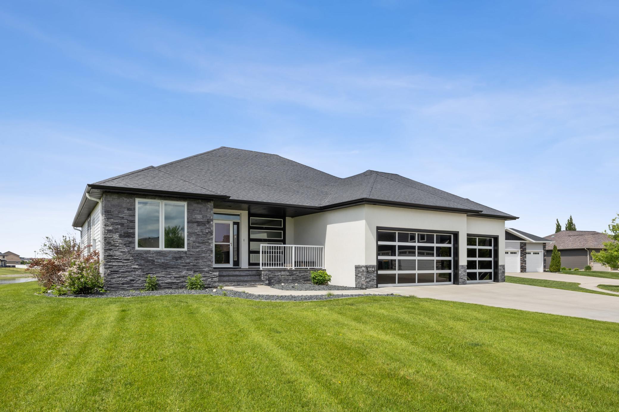Beautiful Exterior w/ Glass Garage Doors
