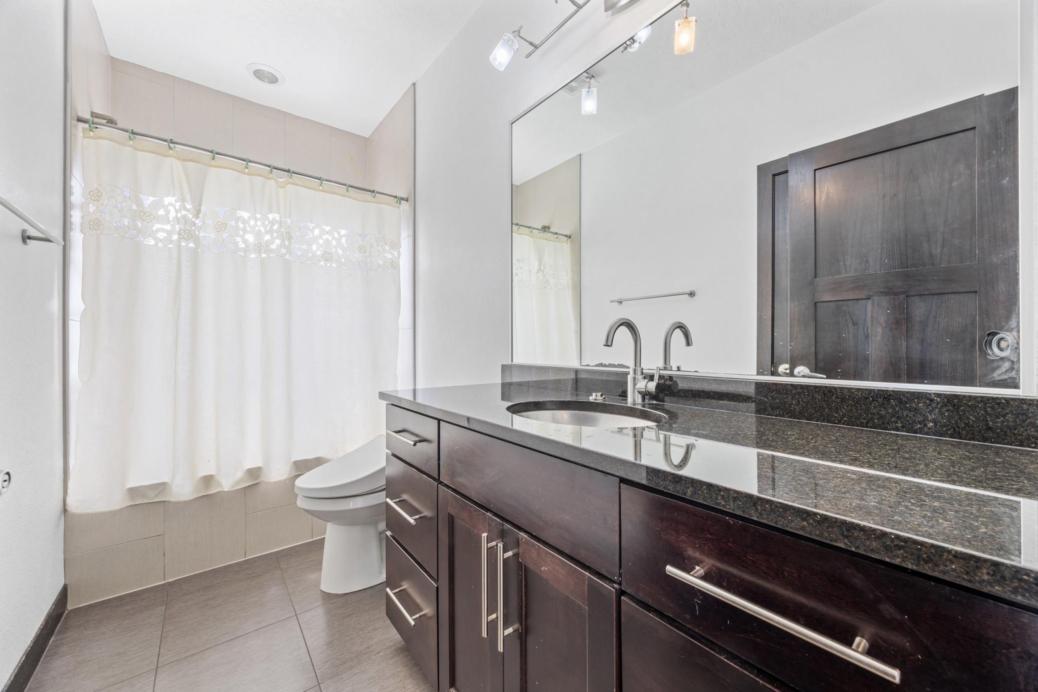 Main Floor Bathroom w/ Tile Surround Tub