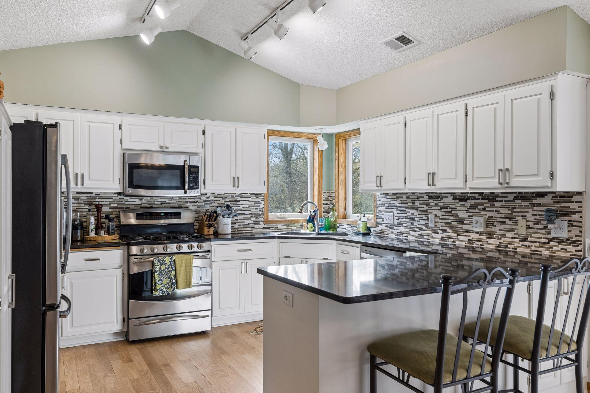 Refinished hardwood floors and freshly painted cabinetry bring a clean, updated look.