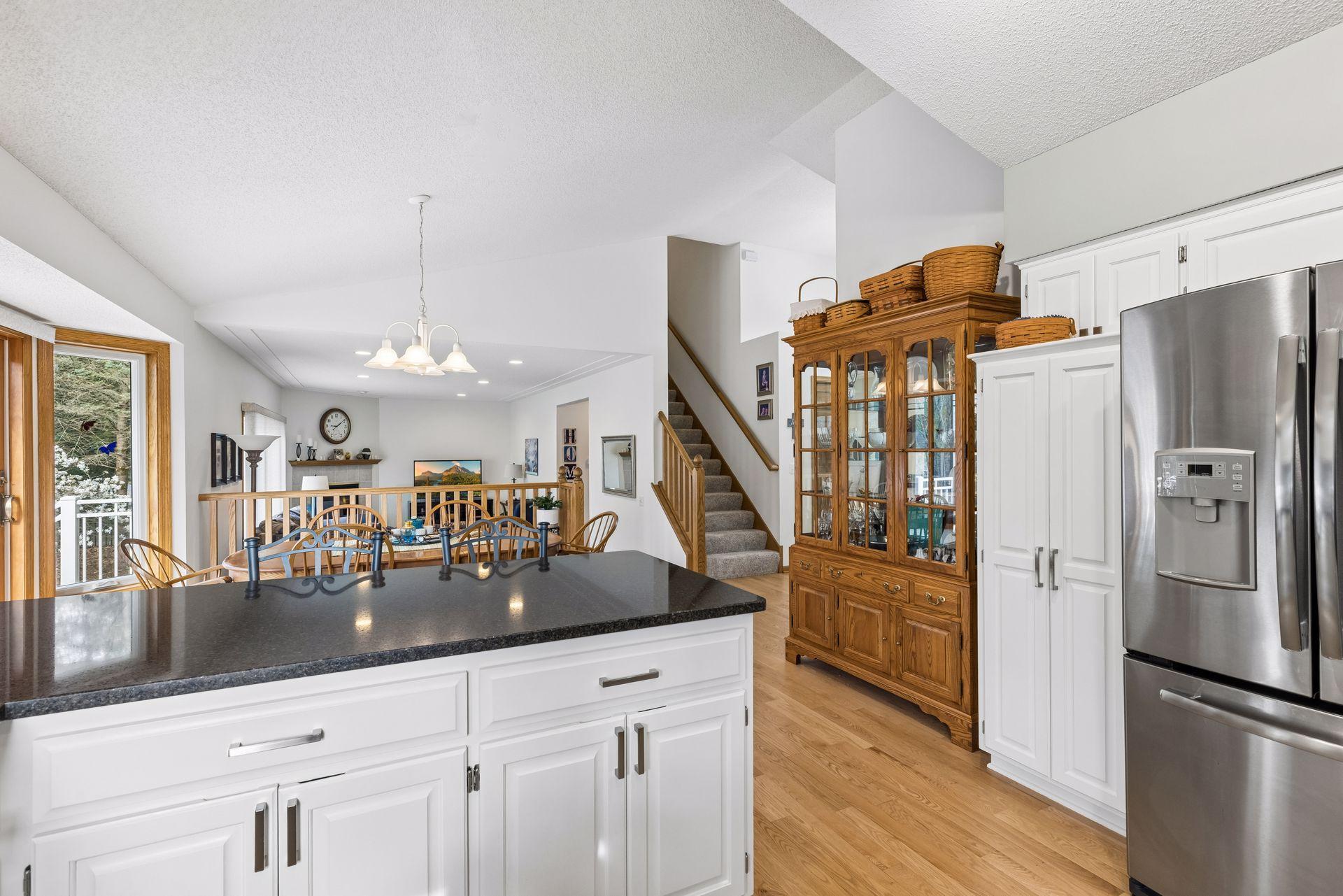 Open sightlines from the kitchen into the dining and living areas.