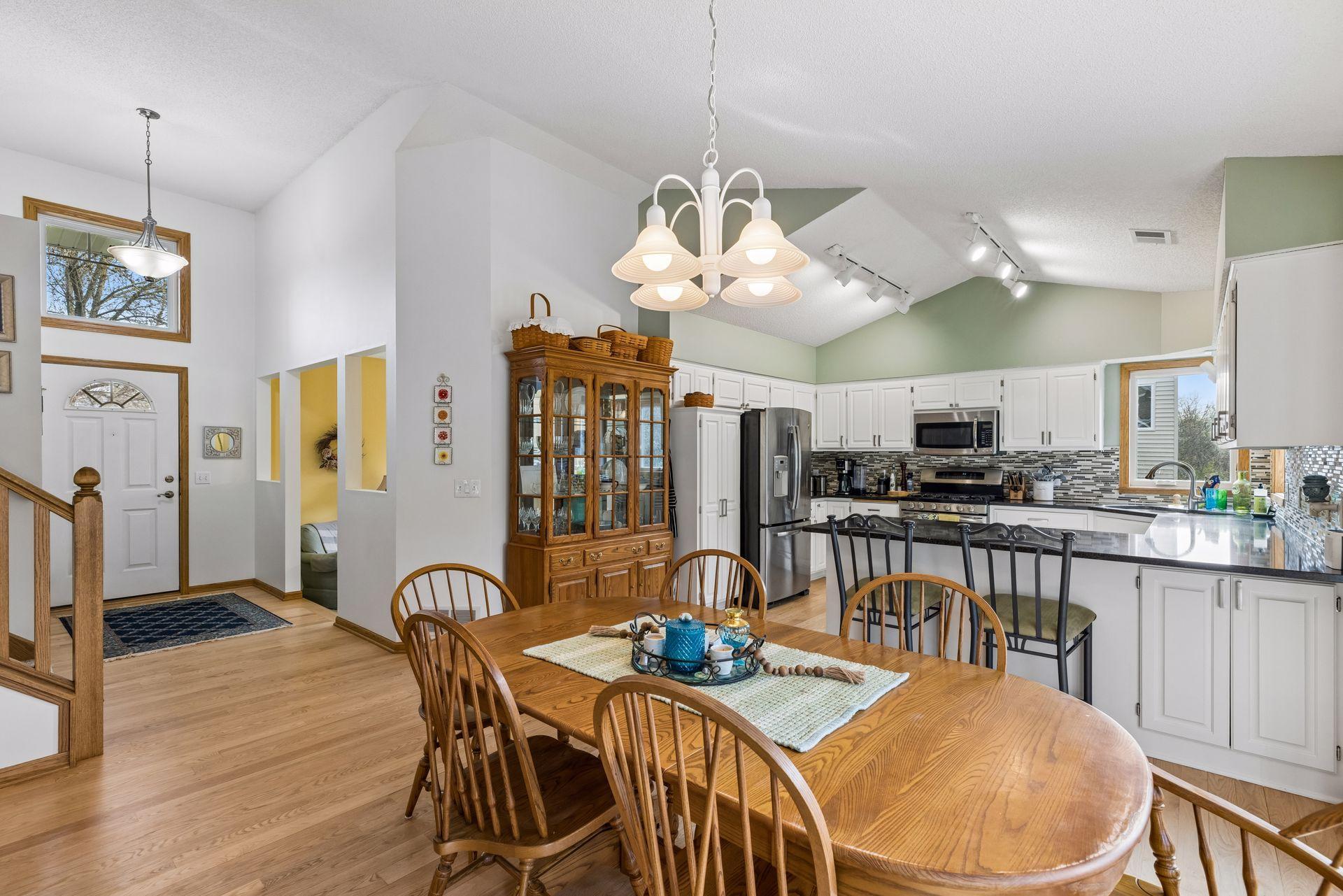 Another view highlighting the connection between kitchen and dining.