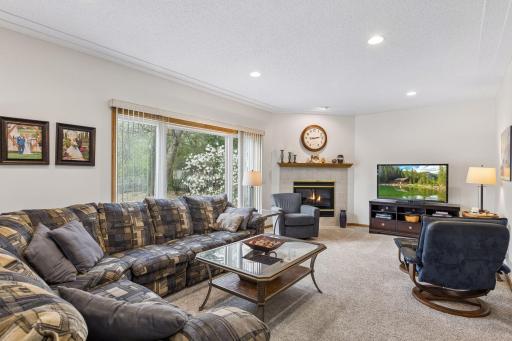 Cozy living room centered around a gas fireplace.
