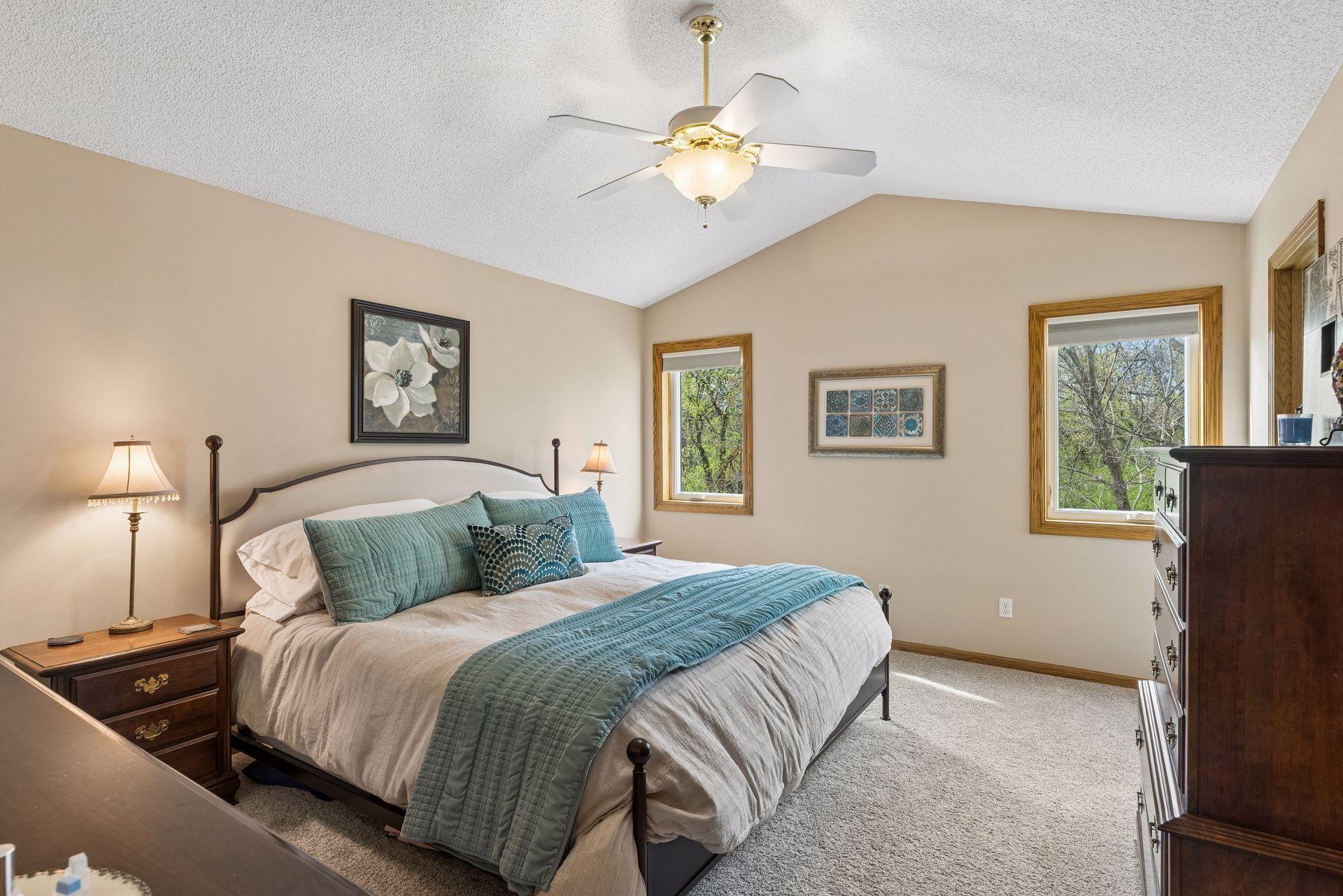 Primary suite with vaulted ceilings and peaceful backyard views.