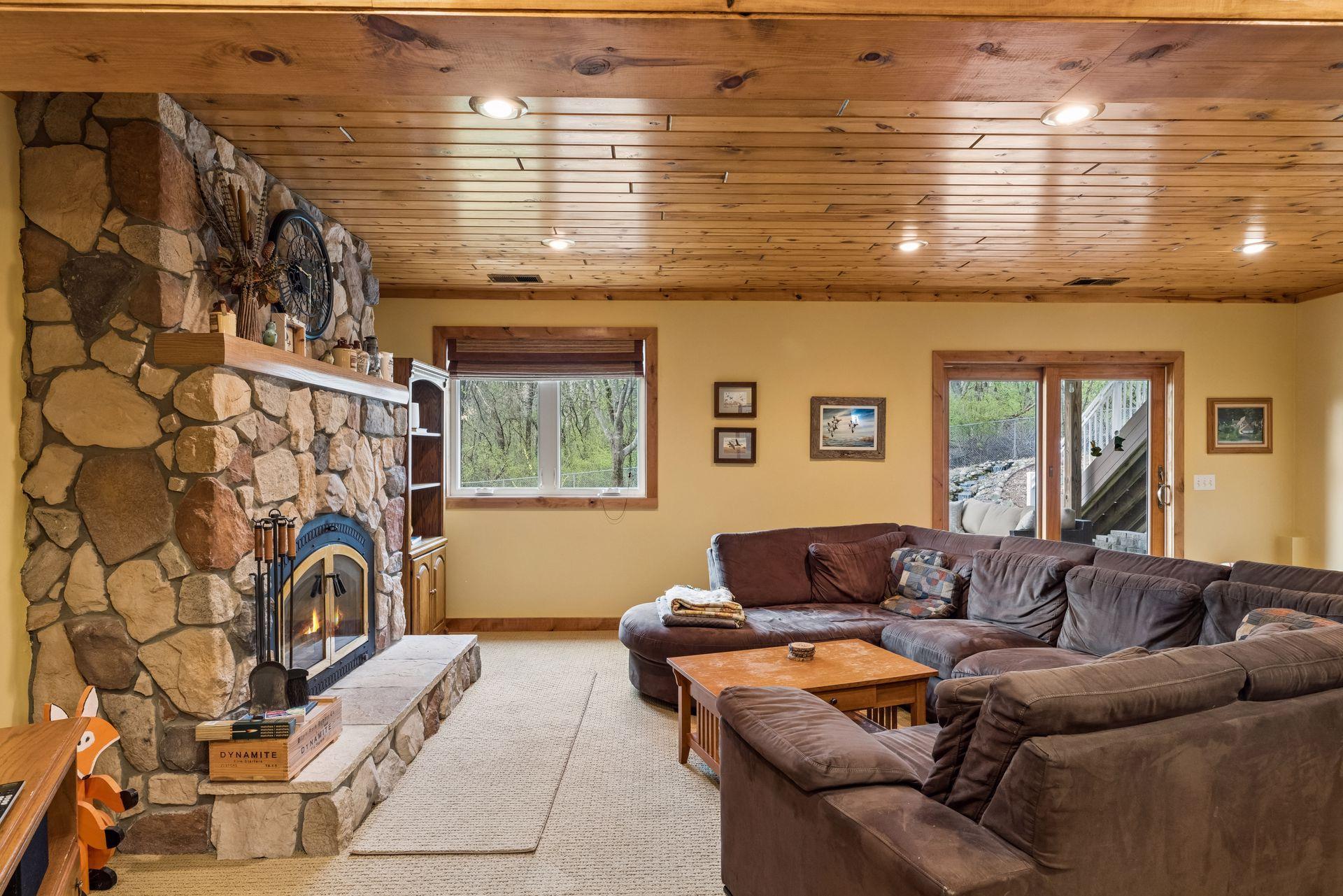 Walkout lower level with inviting ambiance and fireplace.
