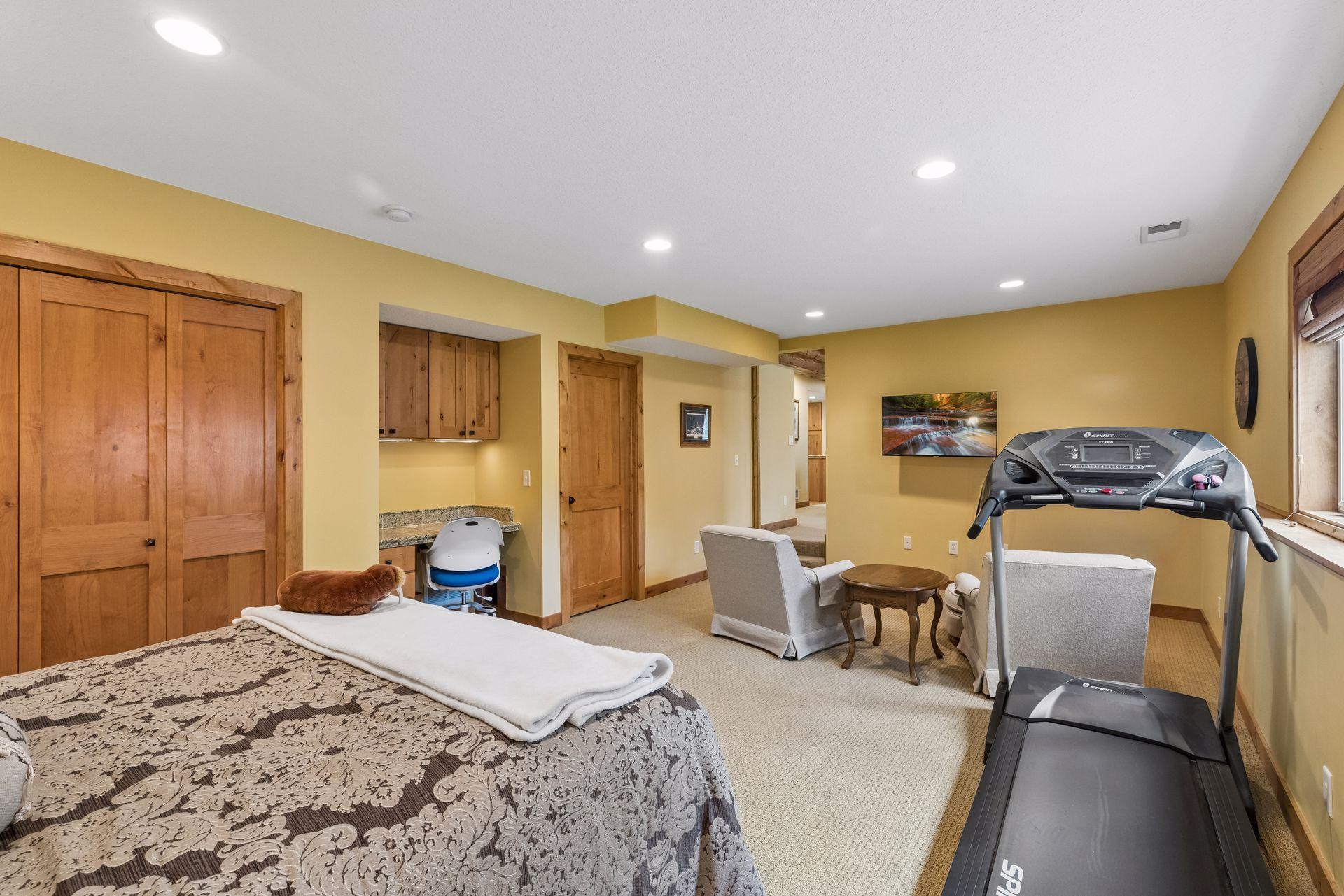 Generous bedroom space with room for a desk, seating, and more.