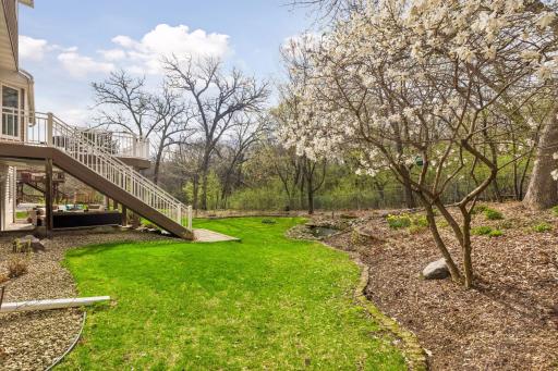 Beautiful landscaping paired with open green space.