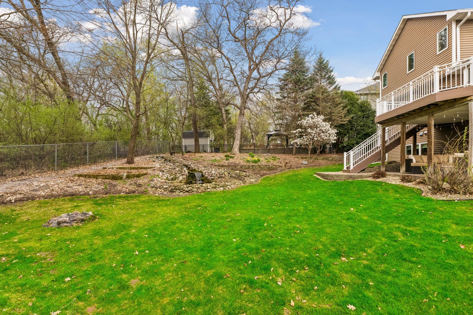 Another backyard view showcasing the outdoor living areas.