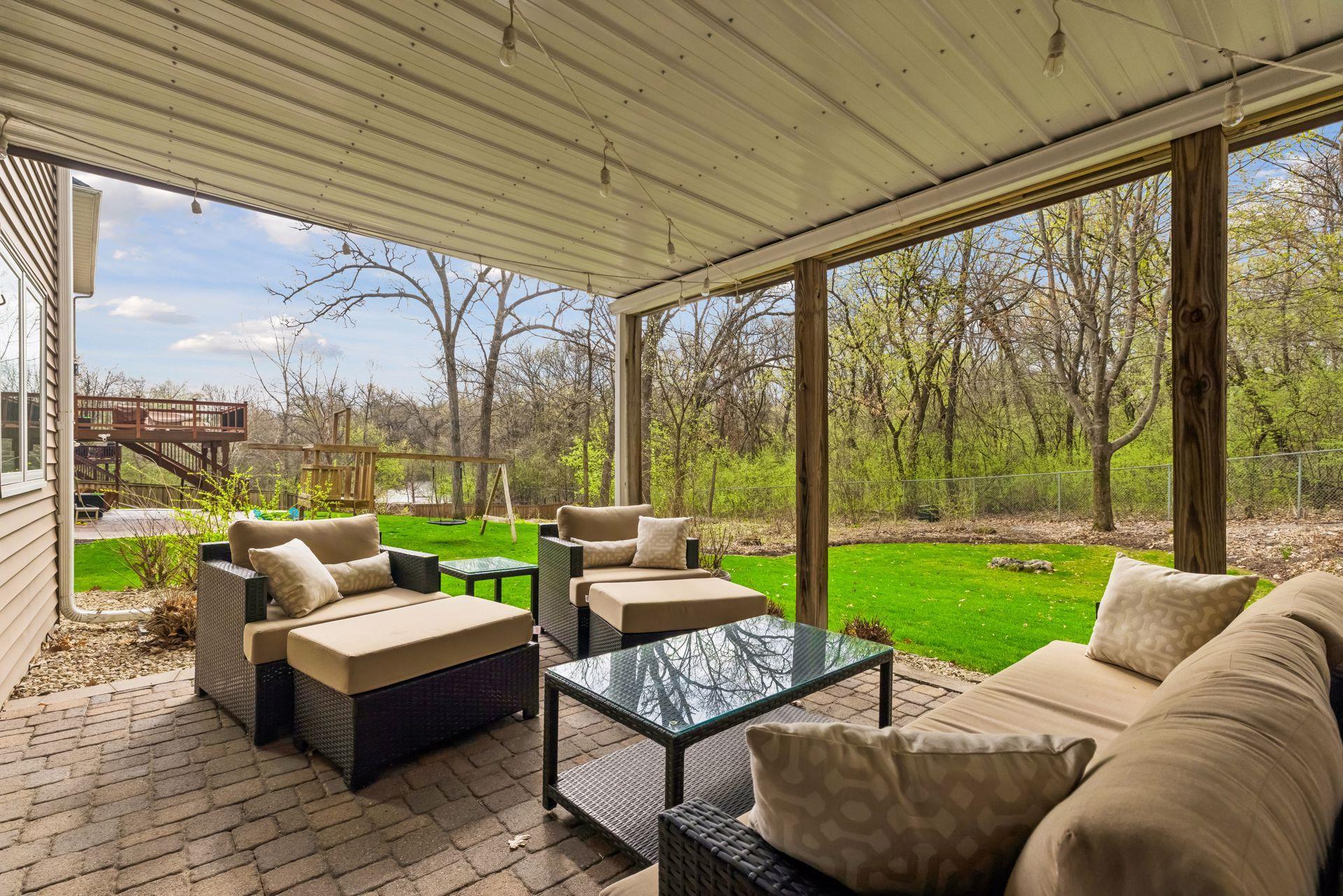 Covered patio beneath the deck with under-decking—enjoy rain or shine.