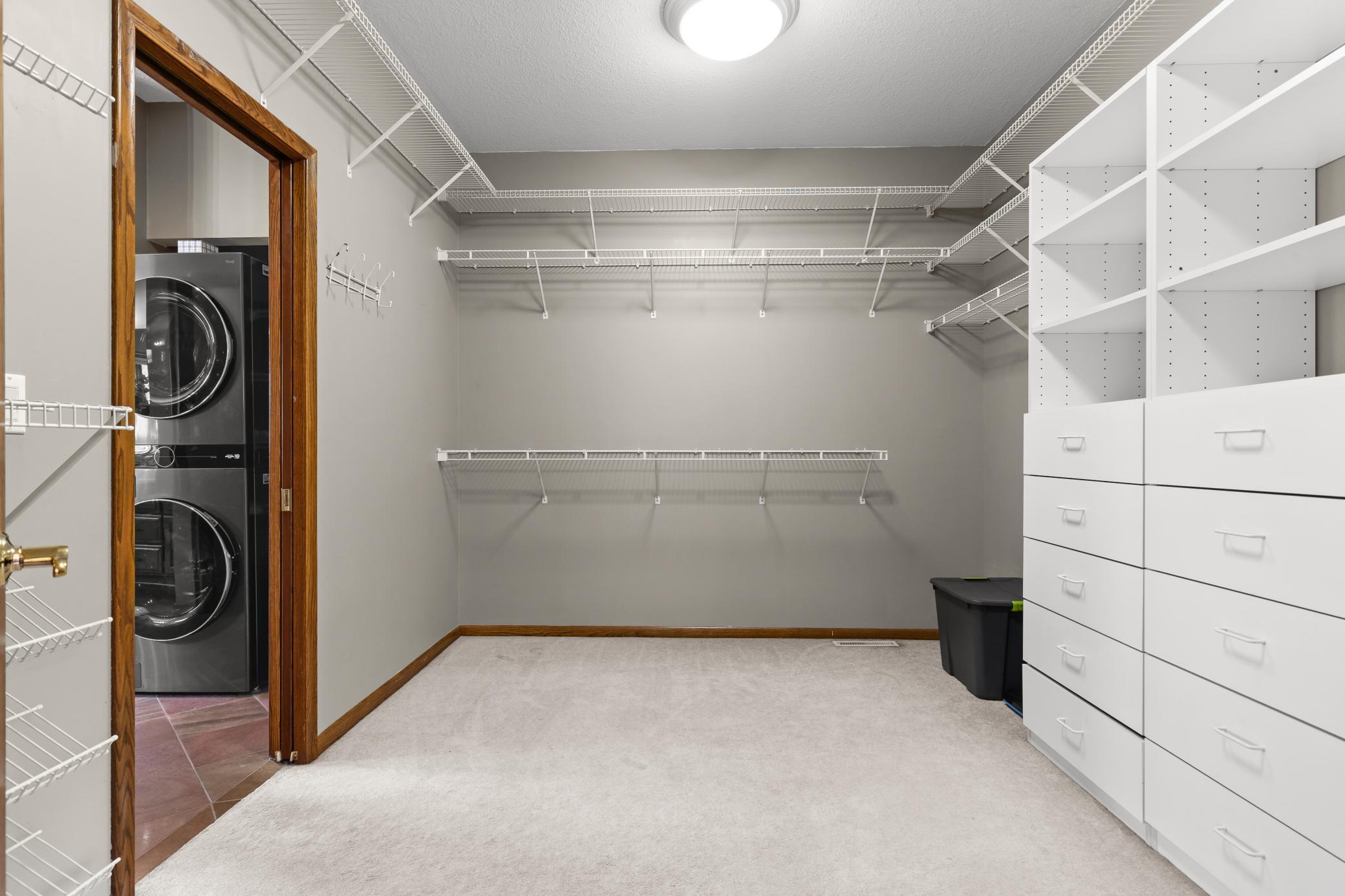 Primary Suite walk-in closet w/ washer & dryer