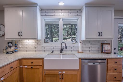 Farmhouse sink adds warmth and character to the kitchen.