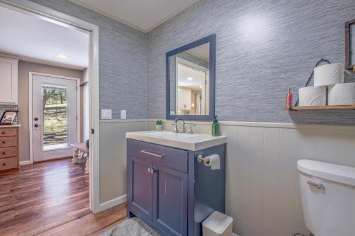 Convenient half bath and laundry just off the kitchen.