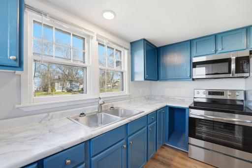 Completely updated kitchen includes stainless steel appliances