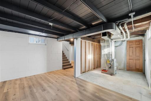 A wall could easily be added to separate the utility room from the family room/flex space