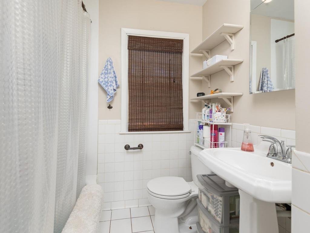 Full Bath has tiled floor, pedestal sink, and new lighted medicine cabinet.