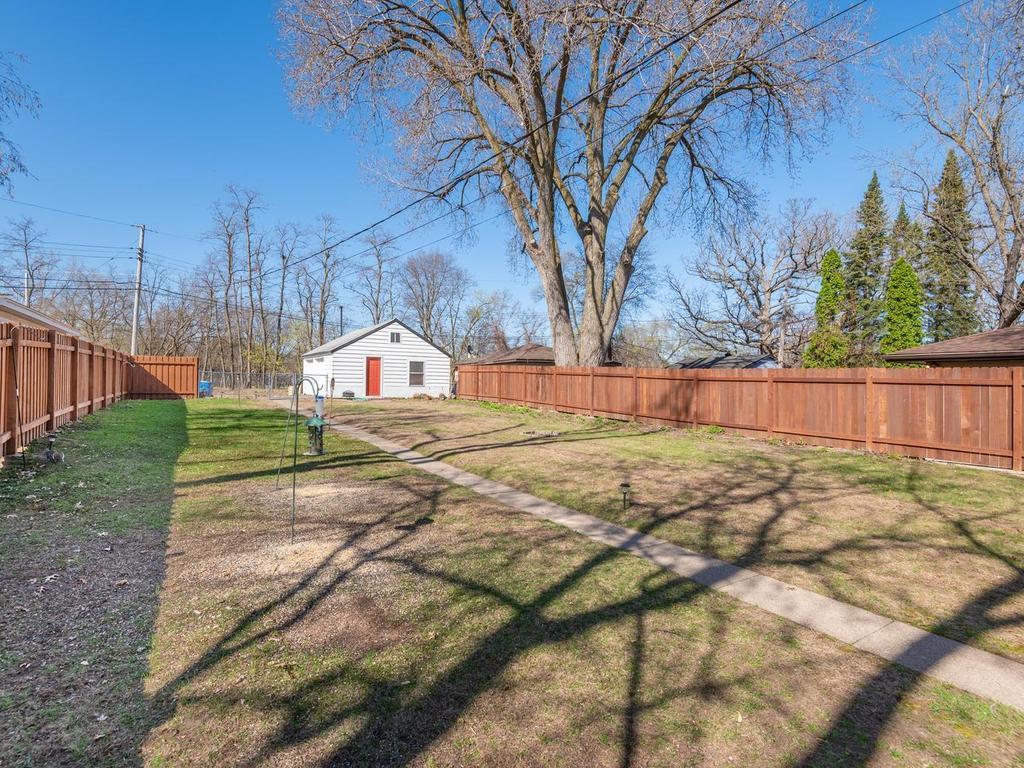 Fenced backyard is a blank canvas & is ready to customize for your own outdoor backyard oasis - plenty of space to design a vegetable/flower garden, patio area, or whatever your heart desires!