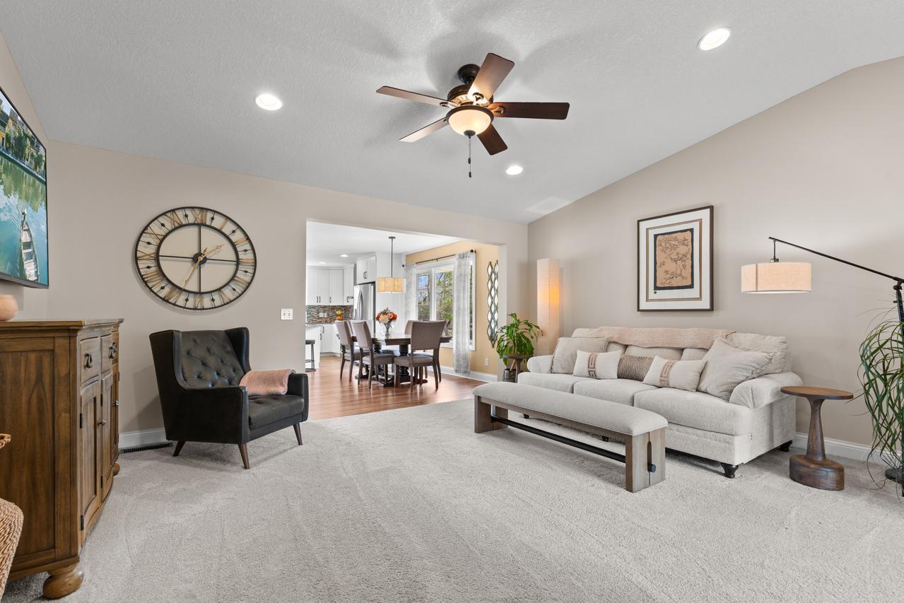 Generous living room with an open, inviting layout and seamless flow to adjacent living areas.