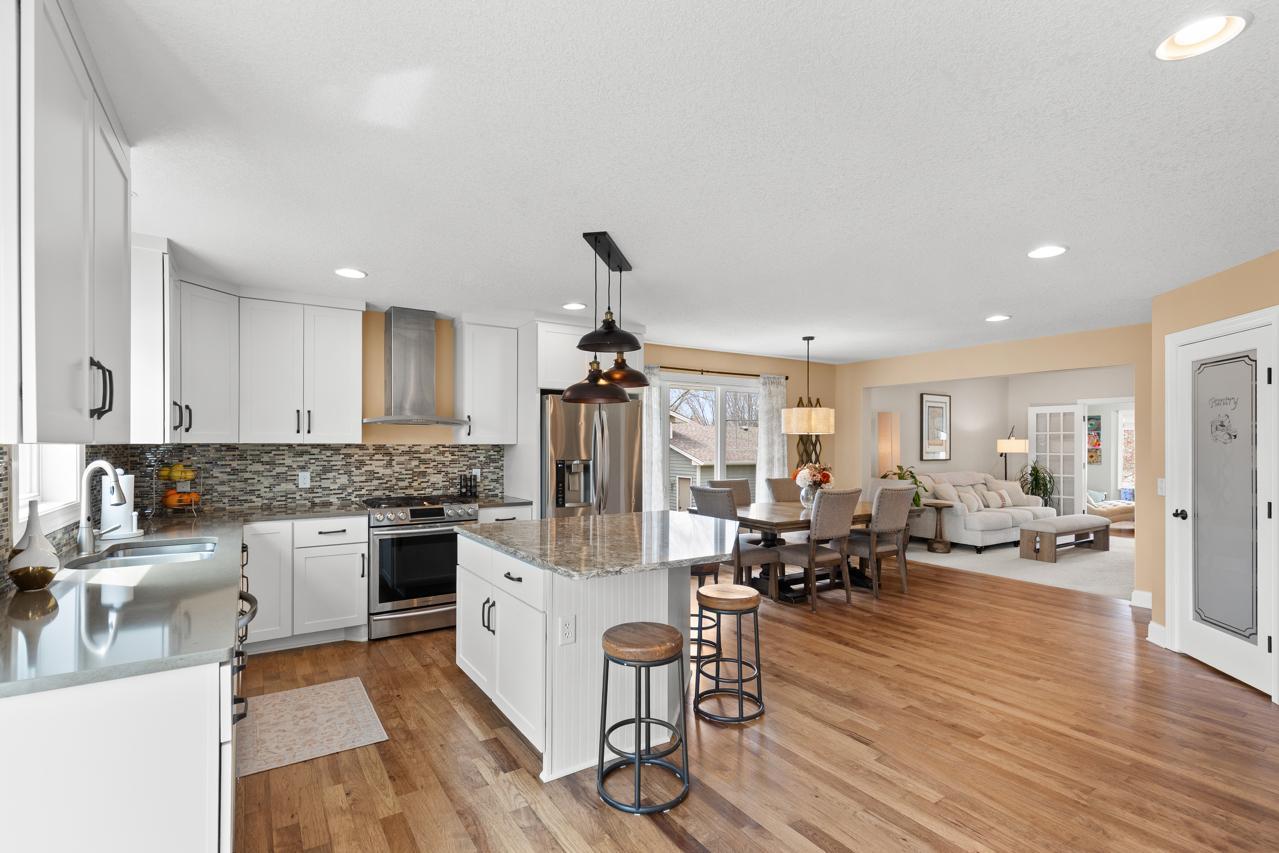 Spacious open-concept main level with seamless flow between the dining and living areas.