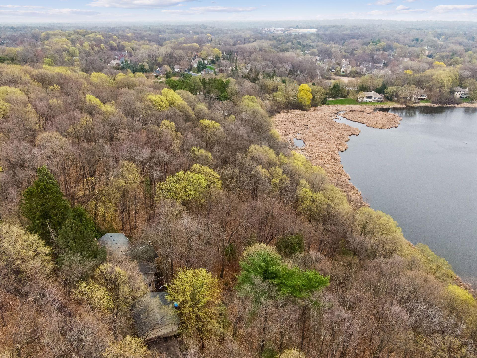 The existing structure is a three-bedroom, two-bathroom walkout rambler. Bring your own builder to design your private lakefront retreat.