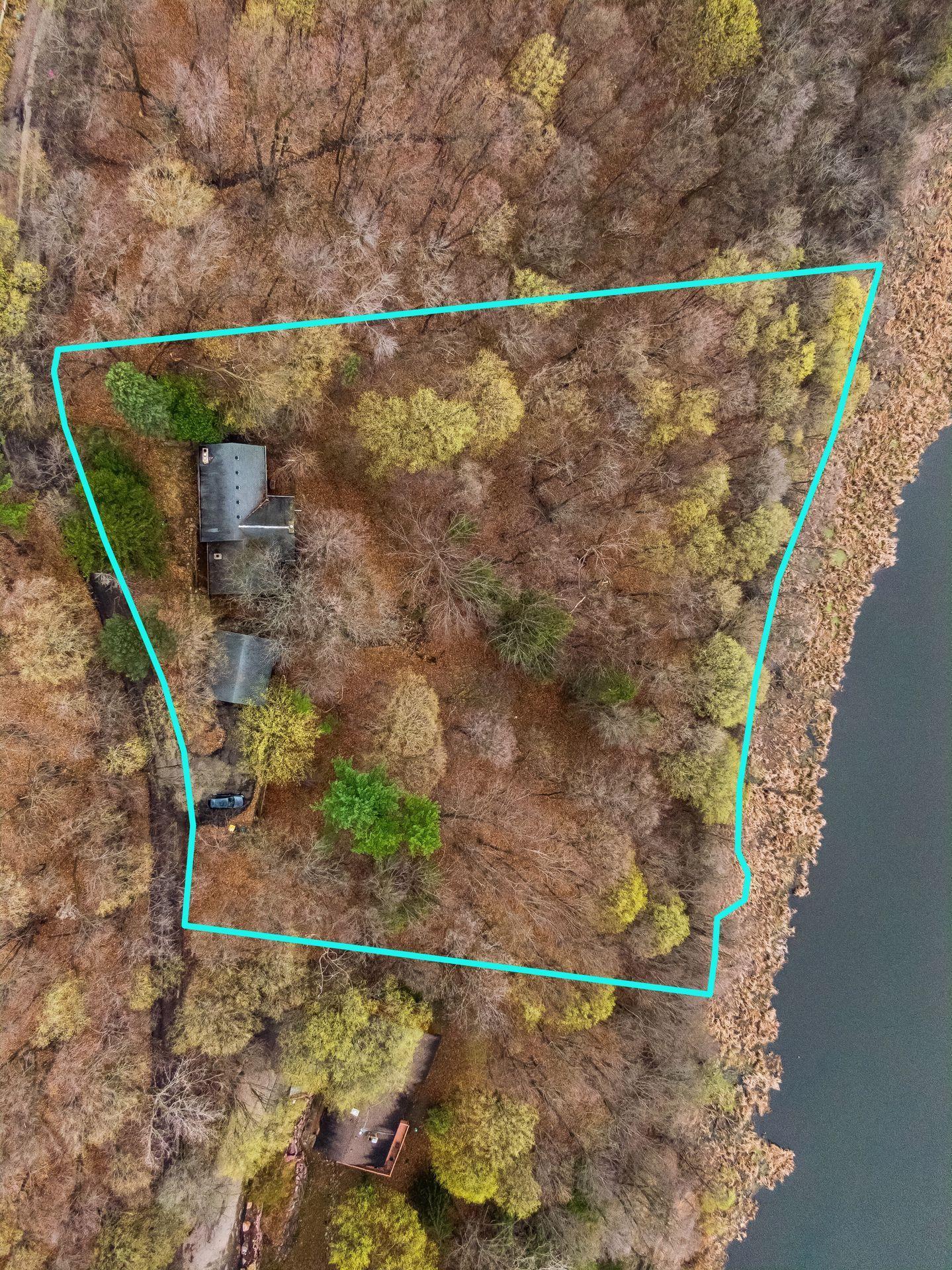 Build your dream home in the heart of Shorewood, Minnesota. This private, wooded 2.3-acre lot features 387 feet of frontage on Silver Lake.