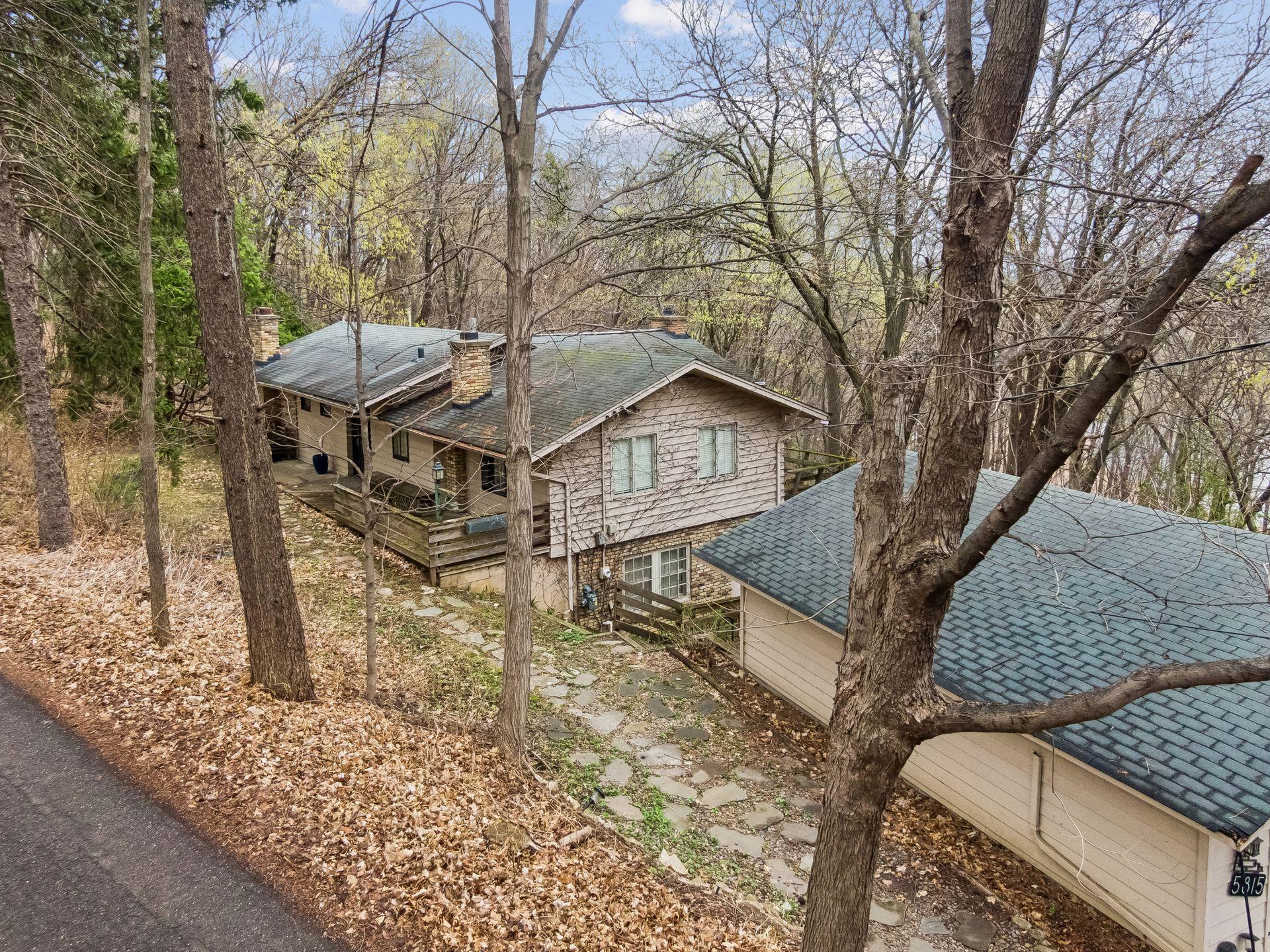 The existing structure is a three-bedroom, two-bathroom walkout rambler. Bring your own builder to design your private lakefront retreat.
