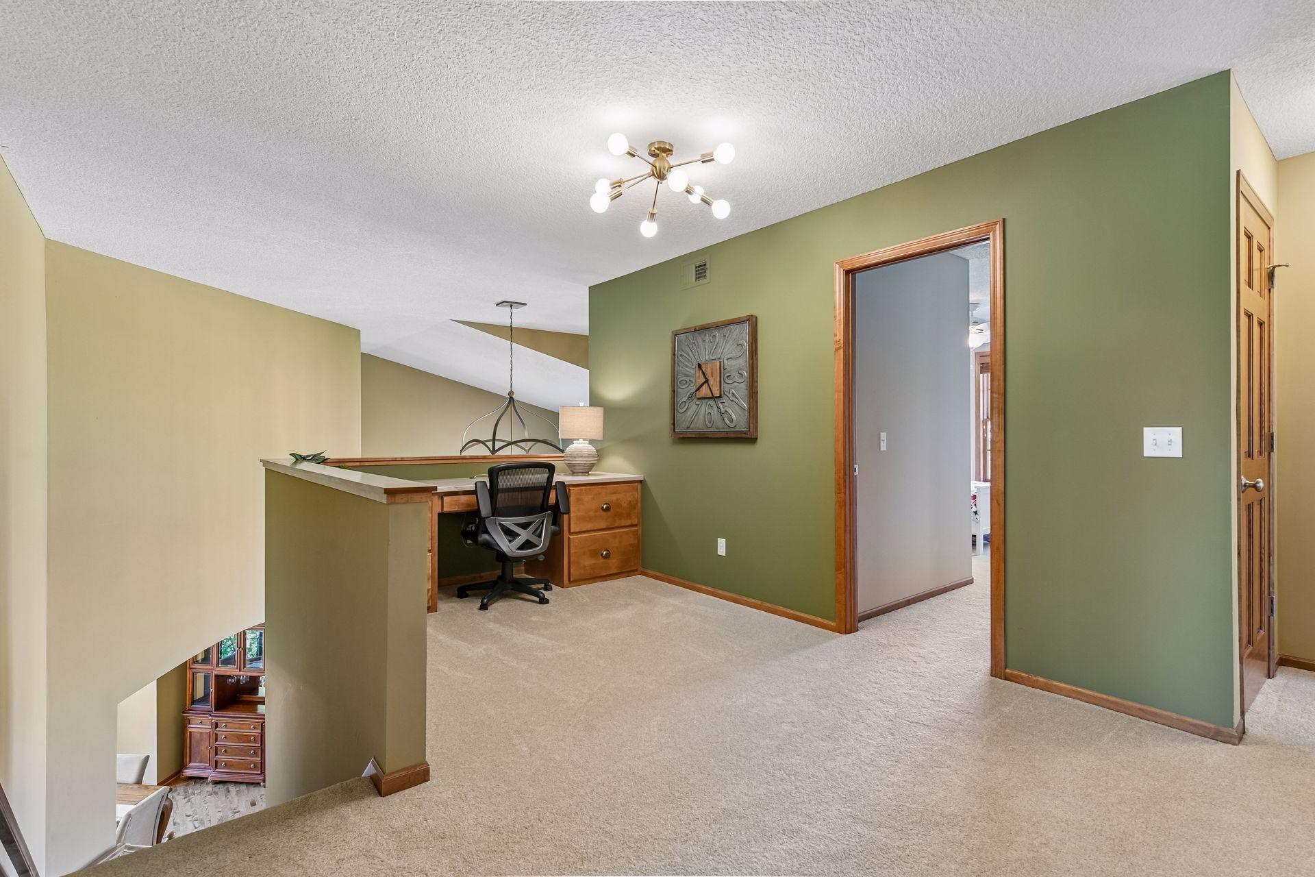 Upstairs you'll find a spacious Loft with built-in desk featuring a new quartzite countertop and designer lighting.