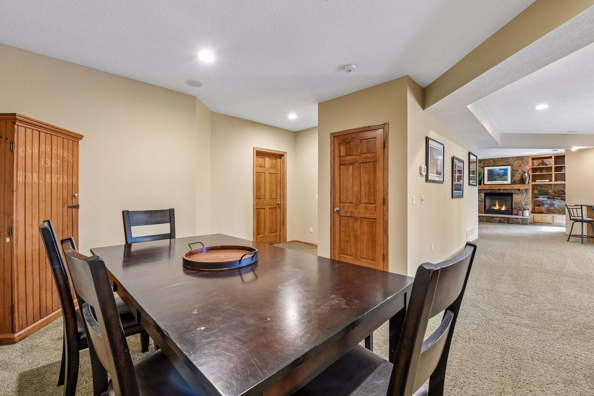 There is plenty of room for a game table and a billiard table in the lower level.