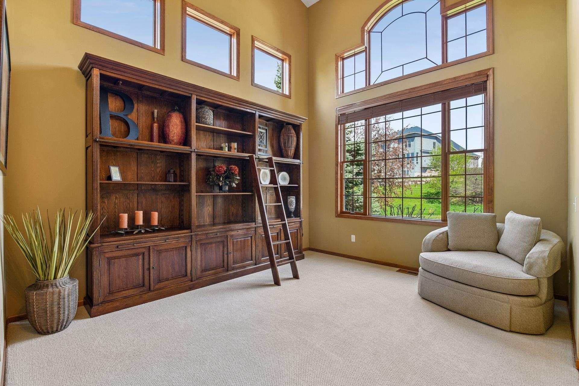 The vaulted sitting room enjoys large windows and tons of natural light.