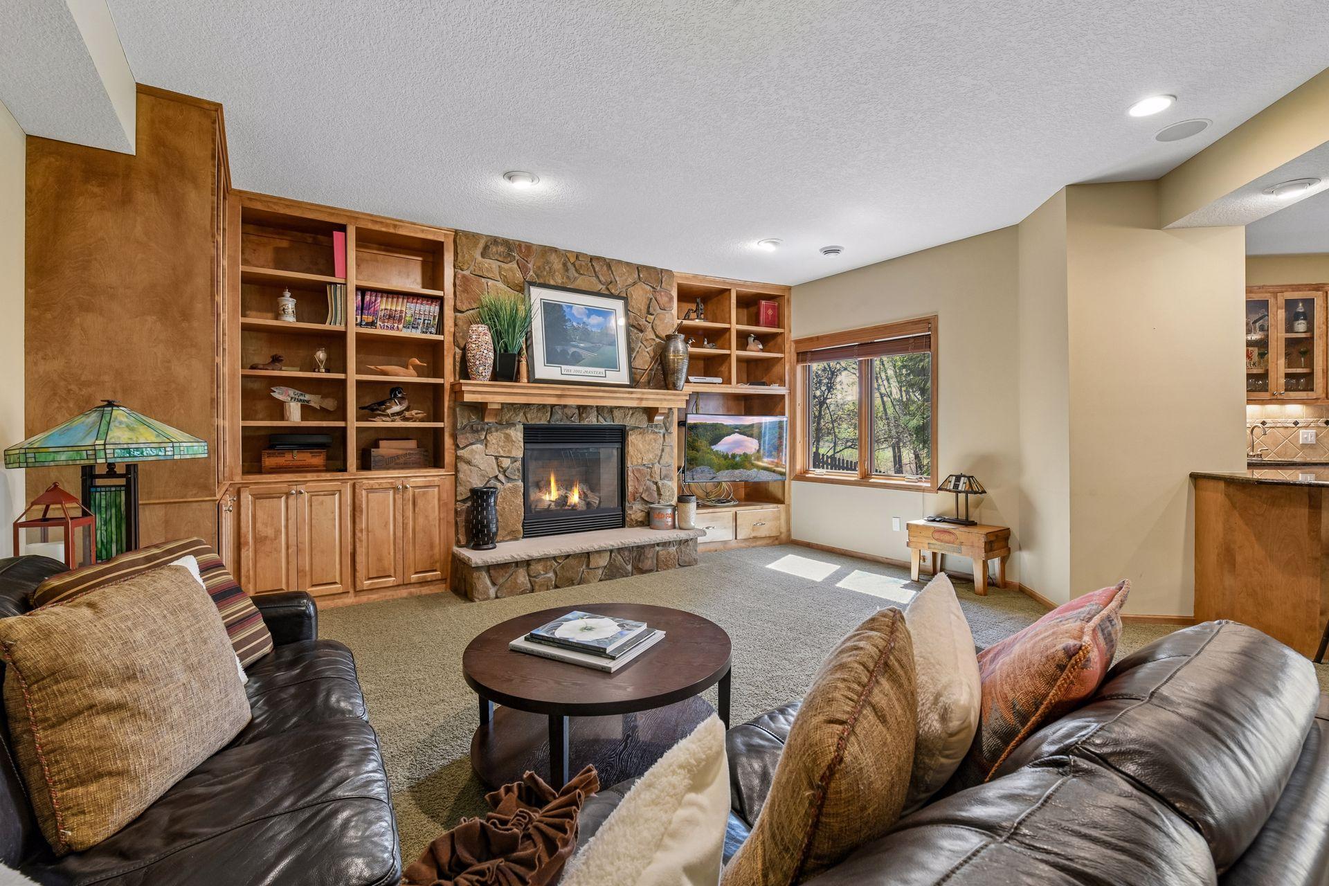 With wall-to-wall built-ins and an inviting gas fireplace, the lower level Family Room is a great spot to cheer on your favorite sports teams!