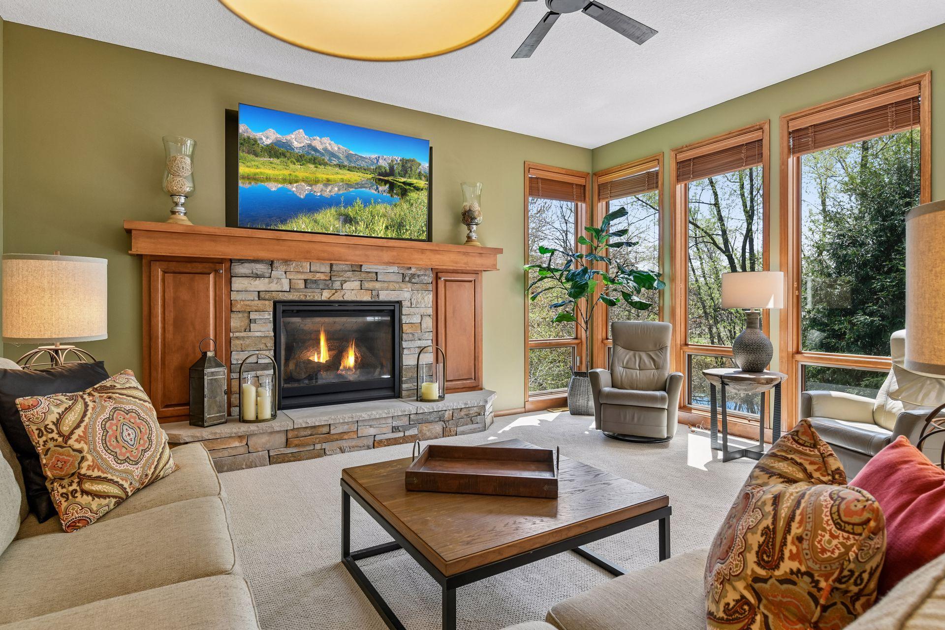 Beautifully remodeled, the Family Room features a new gas fireplace with stone surround, limestone hearth, custom cabinetry and new carpeting.